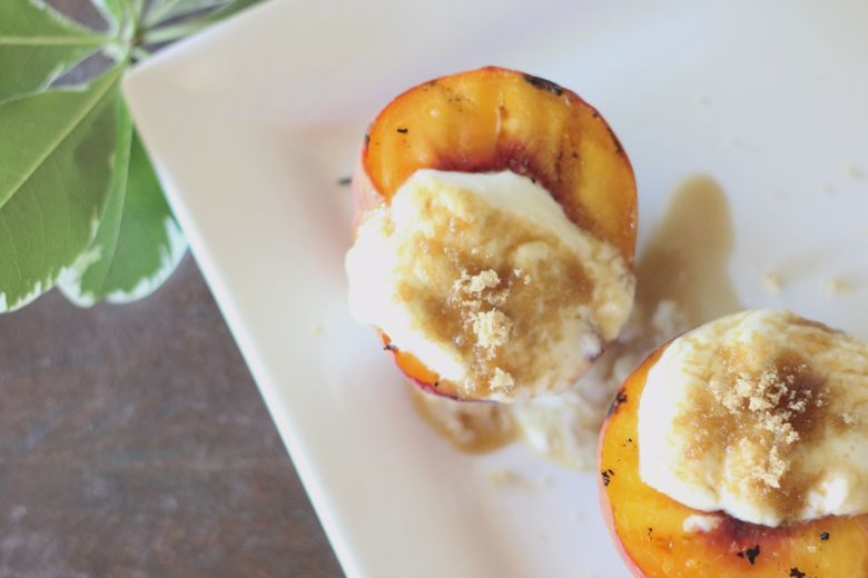 Grilled Peaches With Yogurt Cream Grilled Peaches With Yogurt Cream on top.