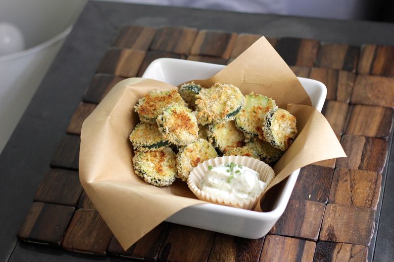 Baked Zucchini piled in a bowl with Skinny Buttermilk Ranch next to it.  