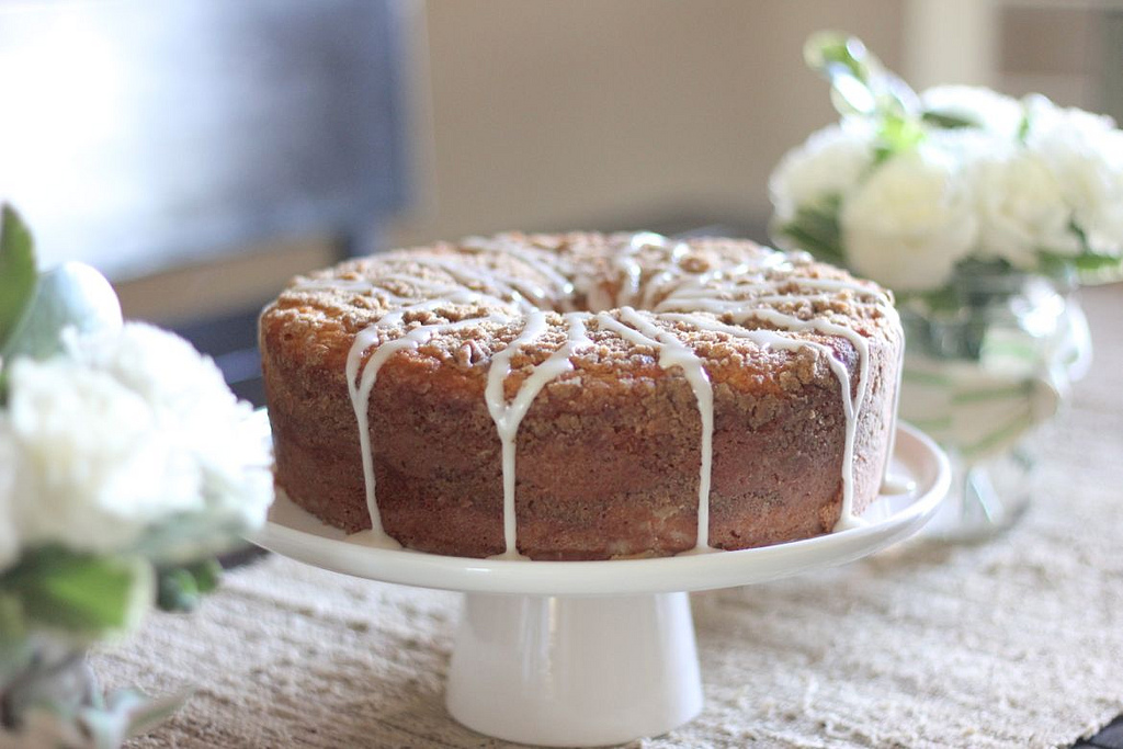 Greek Yogurt Coffee Cake on a cake stand. 