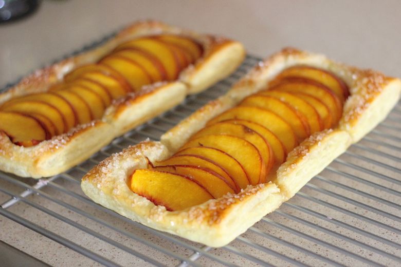 Peach Tarts on cooling rack.