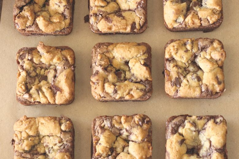 Triple Layer Brownies on parchment paper.  