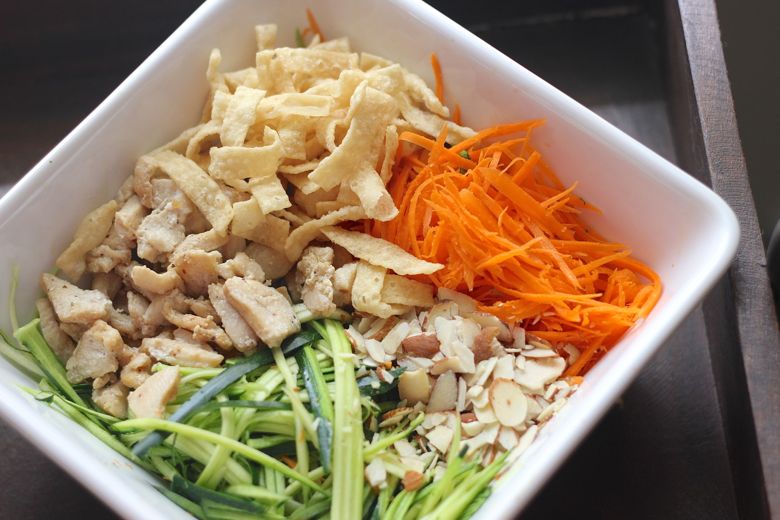 Asian Chicken Veggie Wrap filling ingredients in a large bowl.