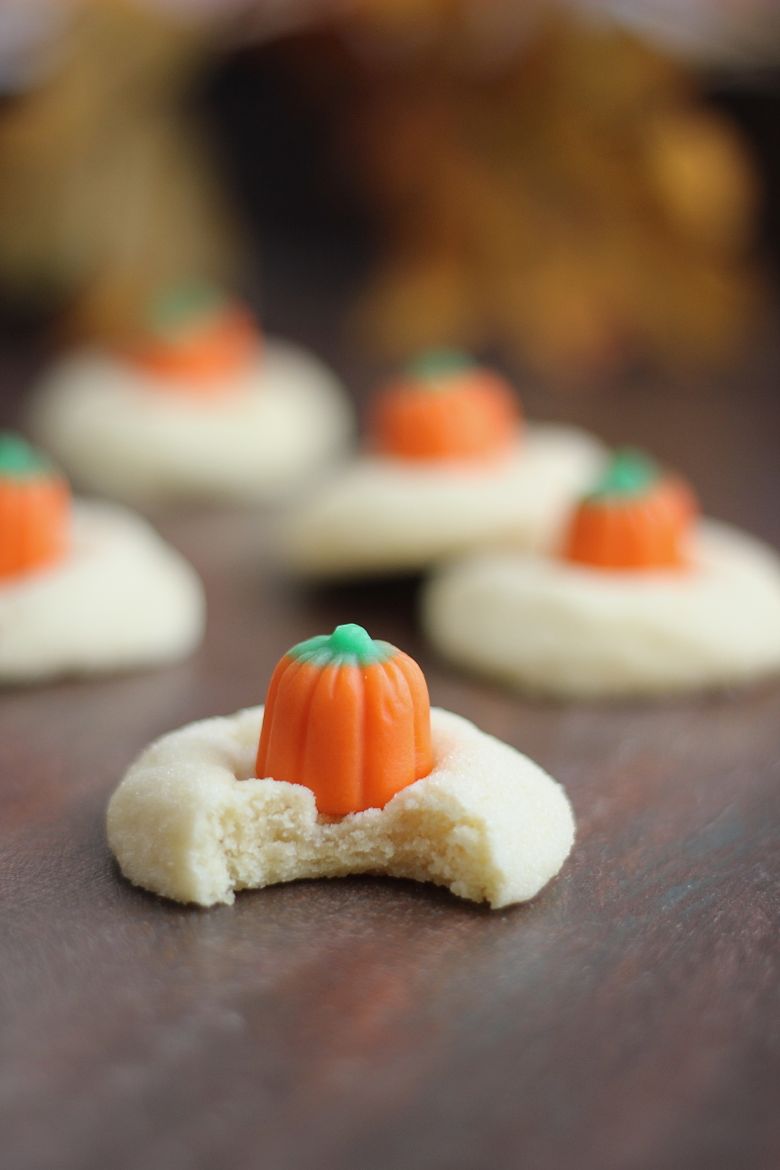 Mellowcreme Pumpkin Cookie with a bite taken out of it.  
