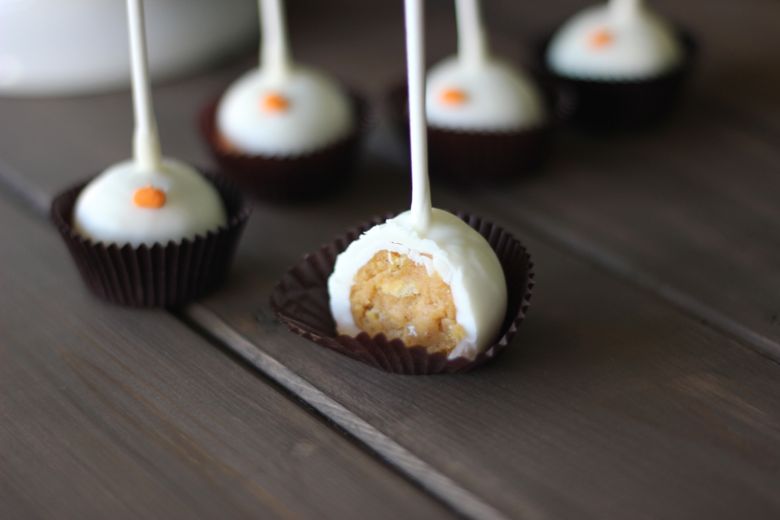 Pumpkin Pie Truffle Pop with a bite taken out of it.  