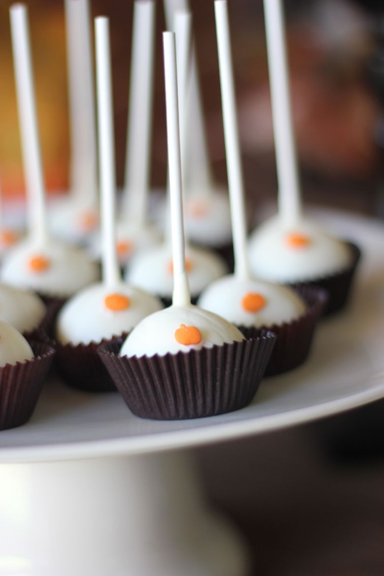 Pumpkin Pie Truffle Pops on a cake stand.  