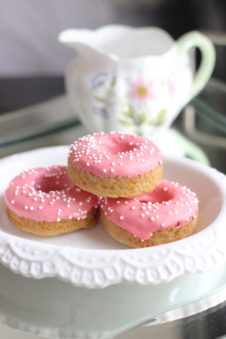 Sugar Cookie Donuts stacked on a plate.
