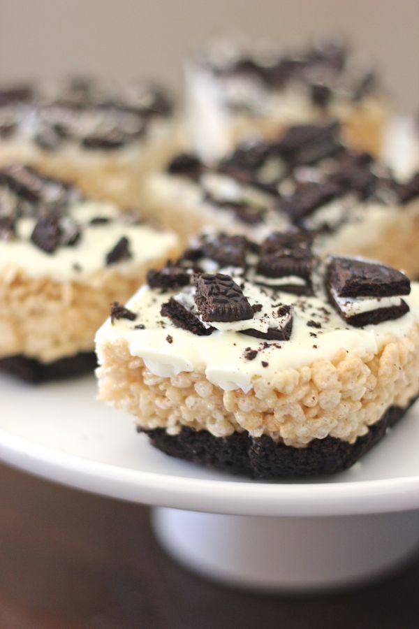 Cookies and Cream Rice Krispie Treats cut in squares on a serving stand.  