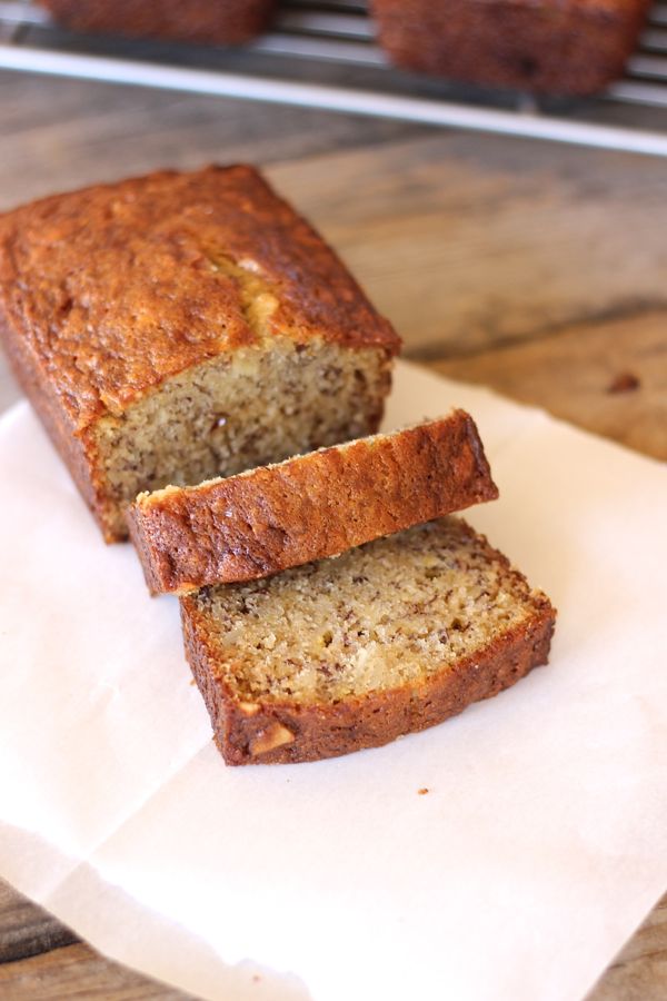 Greek Yogurt Banana Bread loaf with two slices.  