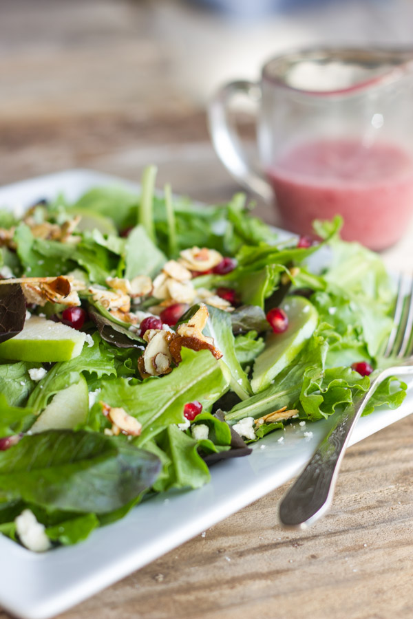 Harvest Salad With Cranberry Vinaigrette on a plate with a fork.  