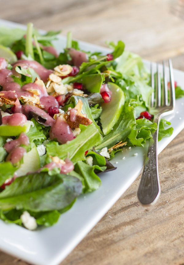 Harvest Salad With Cranberry Vinaigrette on a plate with a fork.  