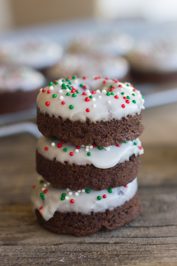 Iced Chocolate Donut Cookies stacked three high.  
