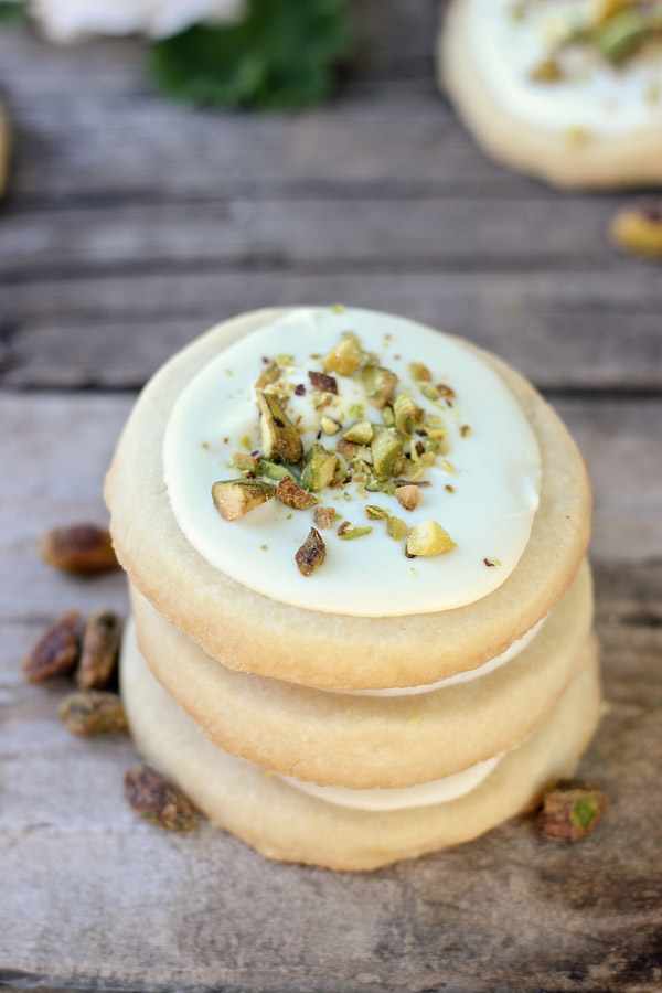 White Chocolate Pistachio Shortbread Cookies in a stack of three.