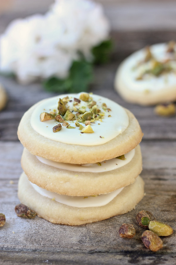 White Chocolate Pistachio Shortbread Cookies in a stack of three.