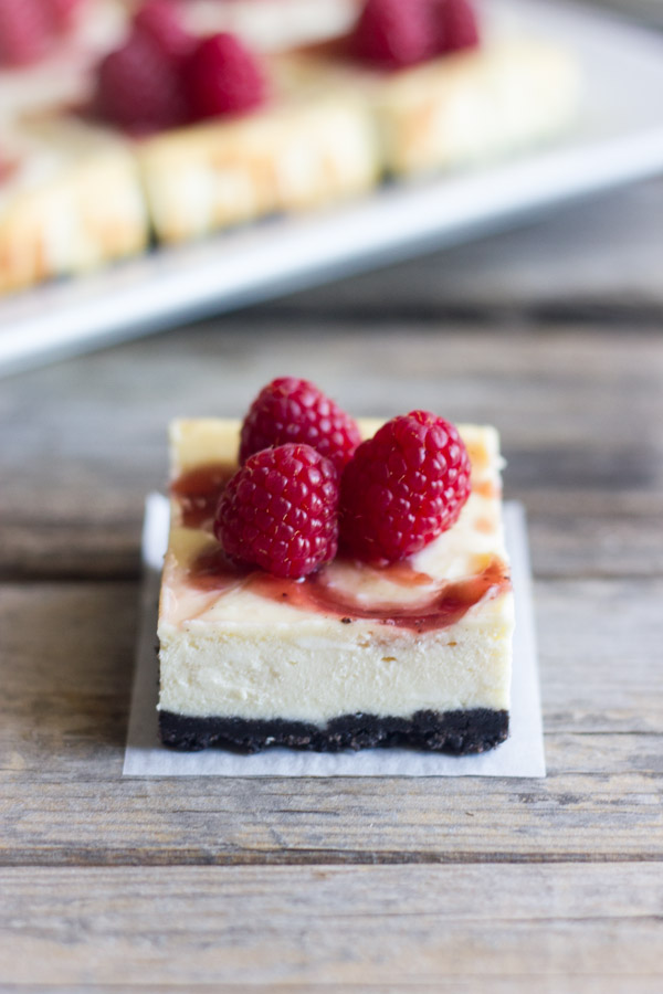 Cute little cheesecake bars with a raspberry swirl and an Oreo crust.
