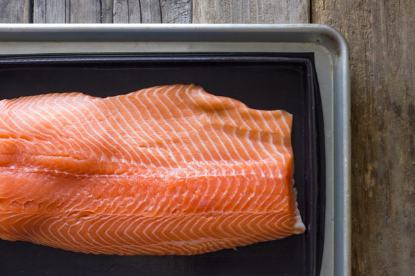 Salmon placed on the Silpat Entremet non-stick baking pan that is on an aluminum baking sheet.