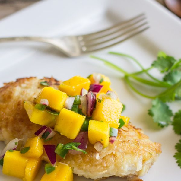 Chicken coated in a crispy coconut breading topped with a sweet and mildly spicy mango salsa.