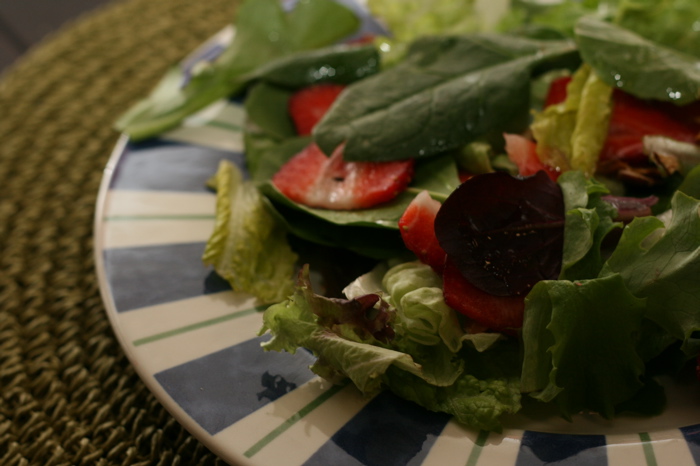 Strawberry and Spinach Salad with Almond Vinaigrette on a plate.