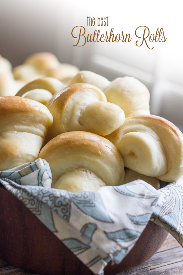 The Best Butterhorn Rolls in a cloth lined wooden bowl.  