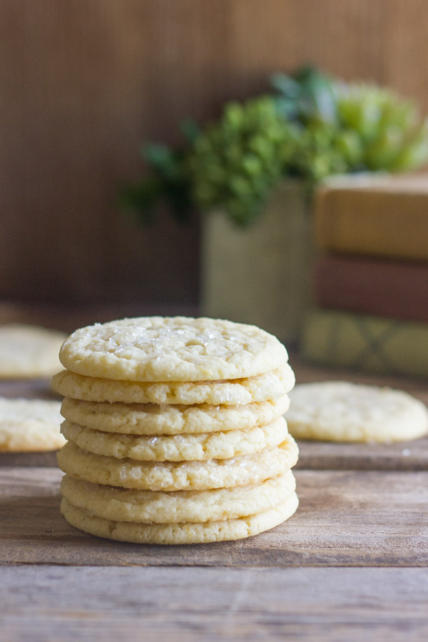 Bakery Style Sugar Cookies in a stack of seven, with more cookies in the background.  