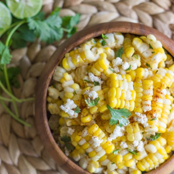 Chili Lime Sweet Corn Salad - sweet corn tossed with butter, fresh lime, chili powder, cilantro, and queso fresco. Amazing!
