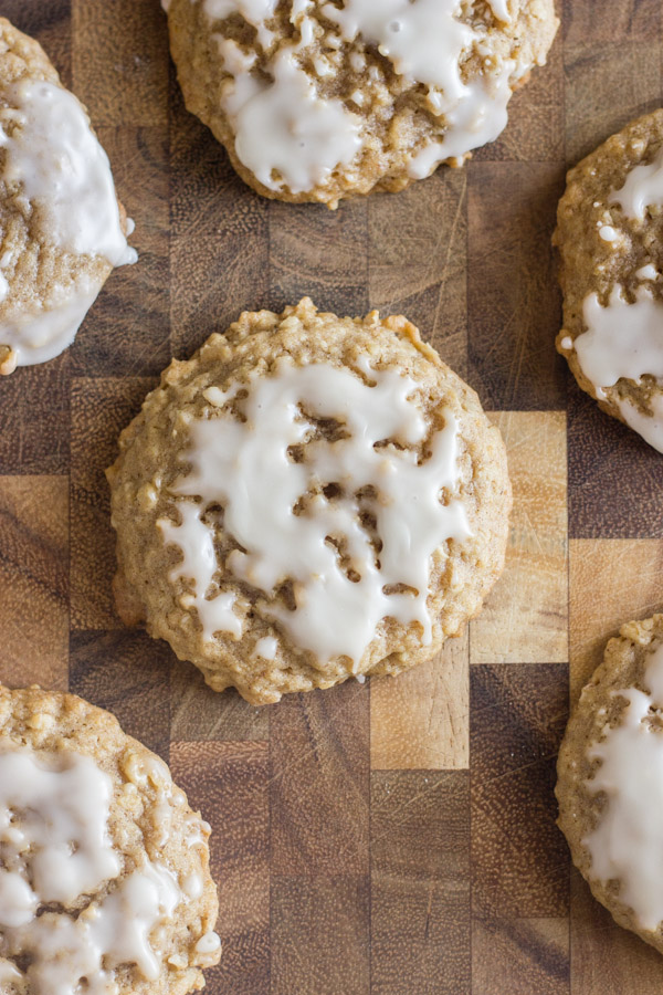 Maple Iced Oatmeal Cookies on a cutting board.  