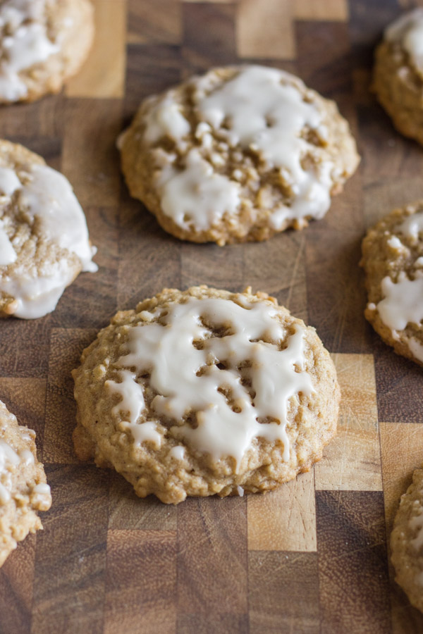 Maple Iced Oatmeal Cookies on a cutting board.  