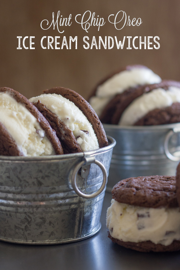 Mint Chip Oreo Ice Cream Sandwiches in galvanized buckets and one Mint Chip Oreo Ice Cream Sandwich next to the bucket.