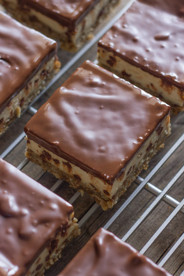 Oatmeal Chocolate Chip Cheesecake Bars on a cooling rack.