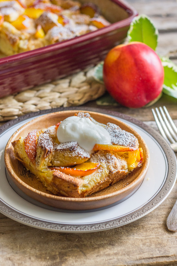 Peaches and Cream French Toast Bake - topped with juicy, ripe, peaches & homemade whipped cream