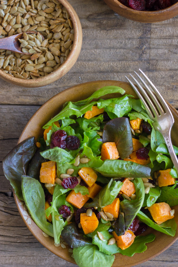 Roasted Sweet Potato Salad - roasted sweet potatoes, dried cranberries, and sunflower seeds on mixed baby greens.