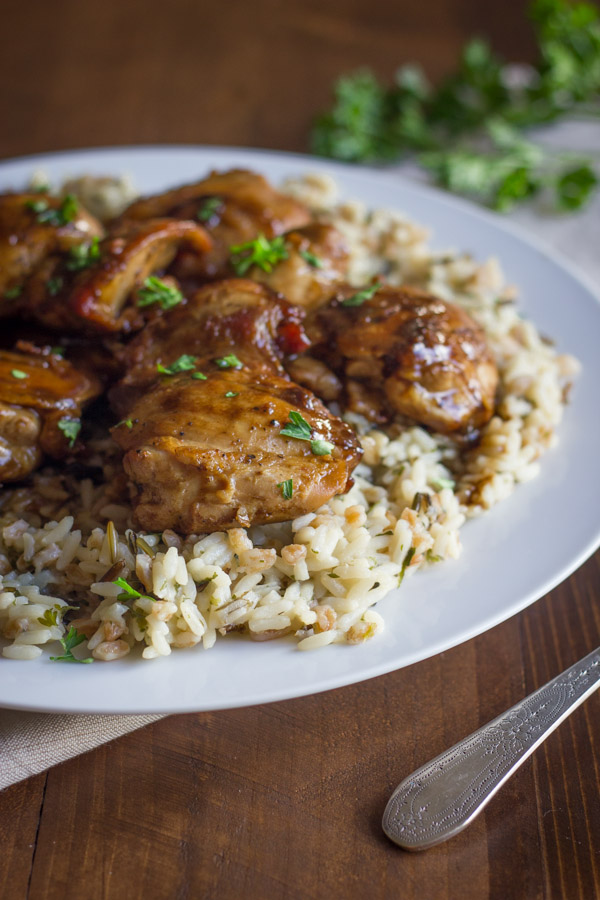 Creamy Balsamic Skillet Chicken - Rich, flavorful, boneless chicken thighs served over rice with a creamy balsamic sauce you'll love!
