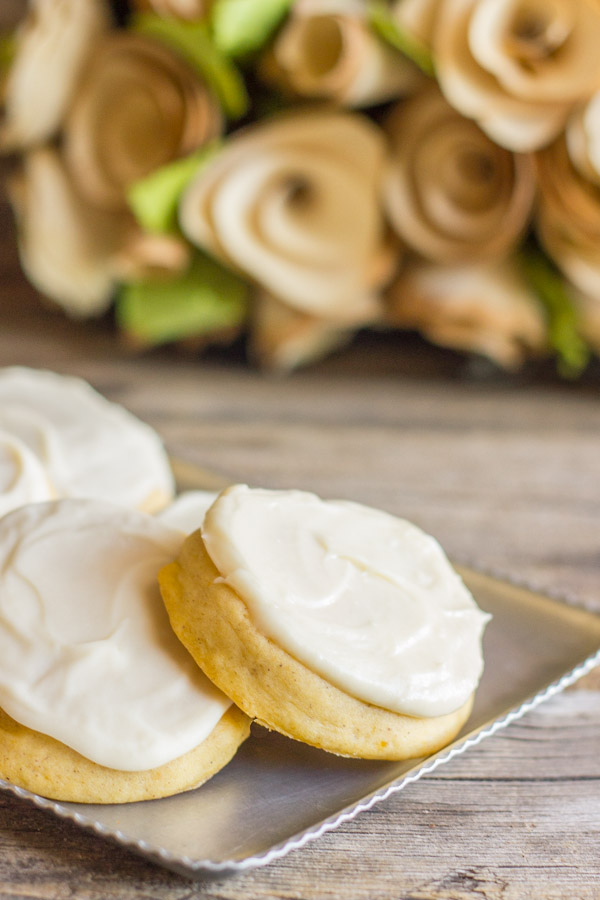 Soft Pumpkin Cookies With Maple Cream Cheese Frosting on a serving platter.  
