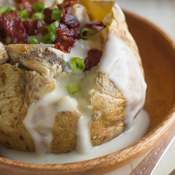 Loaded Chicken and Bacon Alfredo Potato - grilled chicken, crispy bacon, and a creamy, cheesy, homemade alfredo sauce