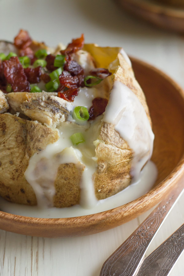 Loaded Chicken and Bacon Alfredo Potato - grilled chicken, crispy bacon, and a creamy, cheesy, homemade alfredo sauce