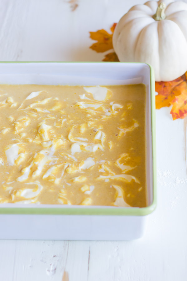 Pumpkin Pie Cheesecake Bars in a baking dish before baking.  