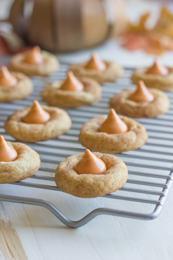 Pumpkin Spice Kissed Snickerdoodles on a cooling rack.  