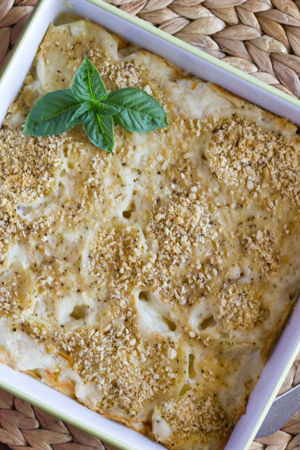 Roasted Garlic Scalloped Potatoes in a square baking dish.
