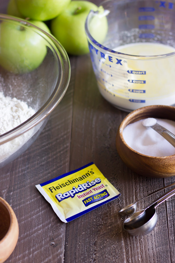 A packet of Fleischmann's RapidRise Instant Yeast surrounded by other ingredients for the Apple Cinnamon Pull Apart Bread.  