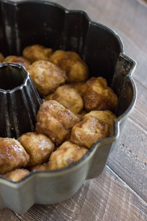 Apple Cinnamon Pull Apart Bread coated dough balls in a fluted tube pan.  