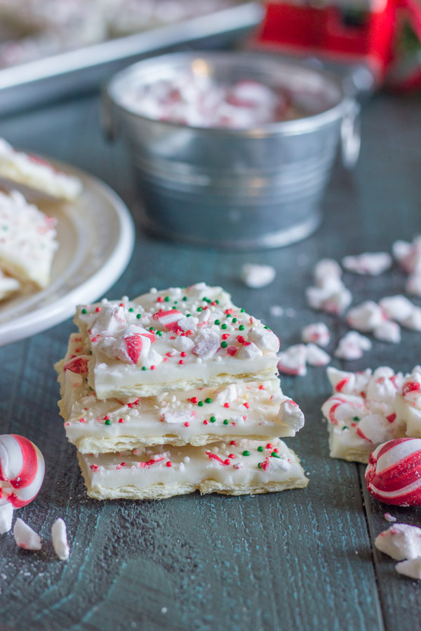 Butter Cracker Peppermint Bark - a thin layer of creamy white chocolate over a buttery, flakey cracker with soft peppermint candies on top.