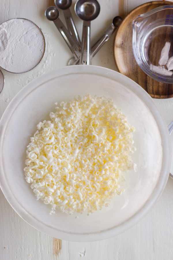 Pie Crust Tutorial Step 1 - grated butter in a bowl.