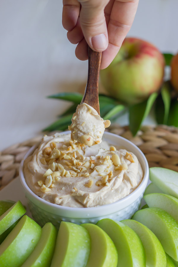 Greek Yogurt Peanut Butter Dip - If you love dipping apple slices in peanut butter, try this dip lightened up with Greek yogurt. Snack away!
