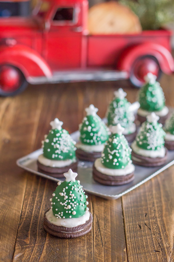 Chocolate Covered Strawberry Christmas Tree in front of a serving tray of more trees. 