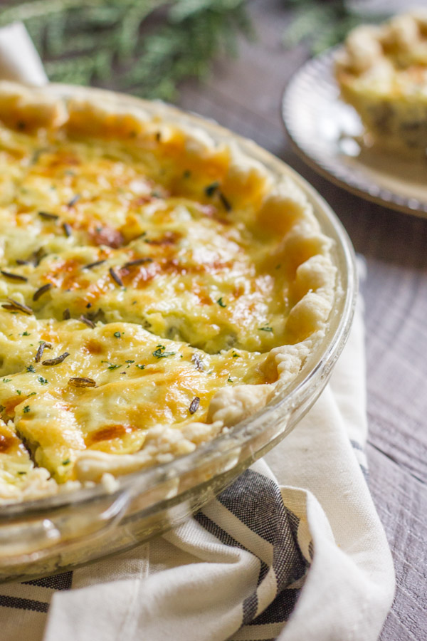Cheesy Wild Rice Quiche in a pie plate.