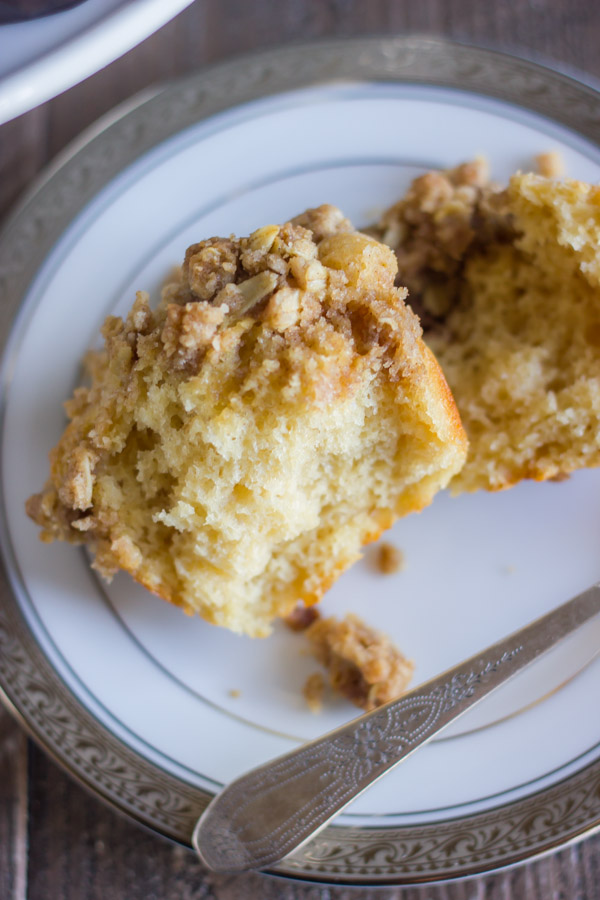 Healthier Cinnamon Oat Streusel Muffin cut open on a plate.  