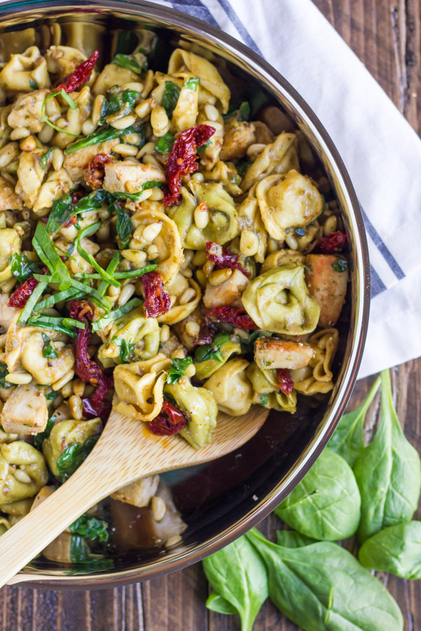 One Skillet Chicken Tortellini - pesto, sun-dried tomatoes, toasted pine nuts, and spinach. It's VERY easy to put together, and has SO much flavor!