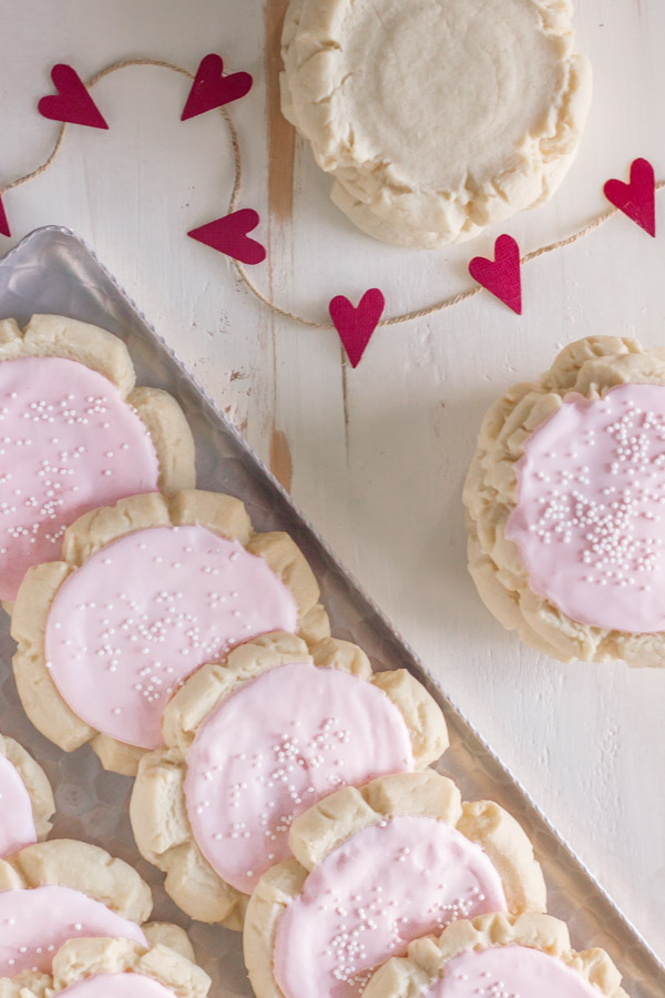 Swig Style Frosted Sugar Cookies - A soft, chewy cookie with a hint of almond extract and a thick layer of sour cream frosting!