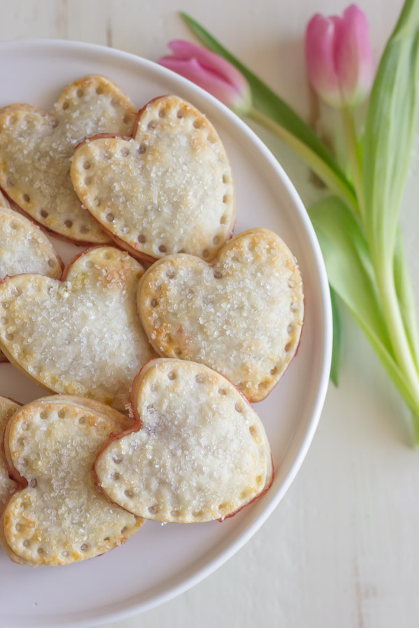 Strawberry Pie Hearts - heart shaped hand pies filled with strawberry preserves and sprinkled with sparkling sugar!