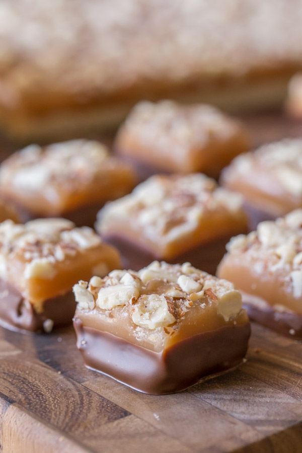 Homemade Caramel Almond Shortbread Bites - Tiny pieces of chocolate covered shortbread topped with the best ever homemade caramel and almonds!