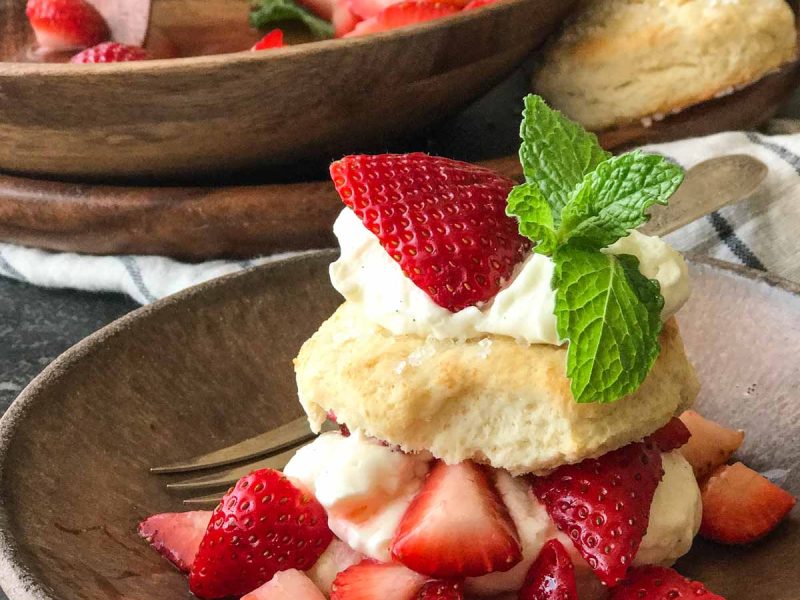 These Homemade Strawberry Shortcakes have a slightly sweetened fluffy buttermilk biscuit with red ripe strawberries and freshly whipped cream!